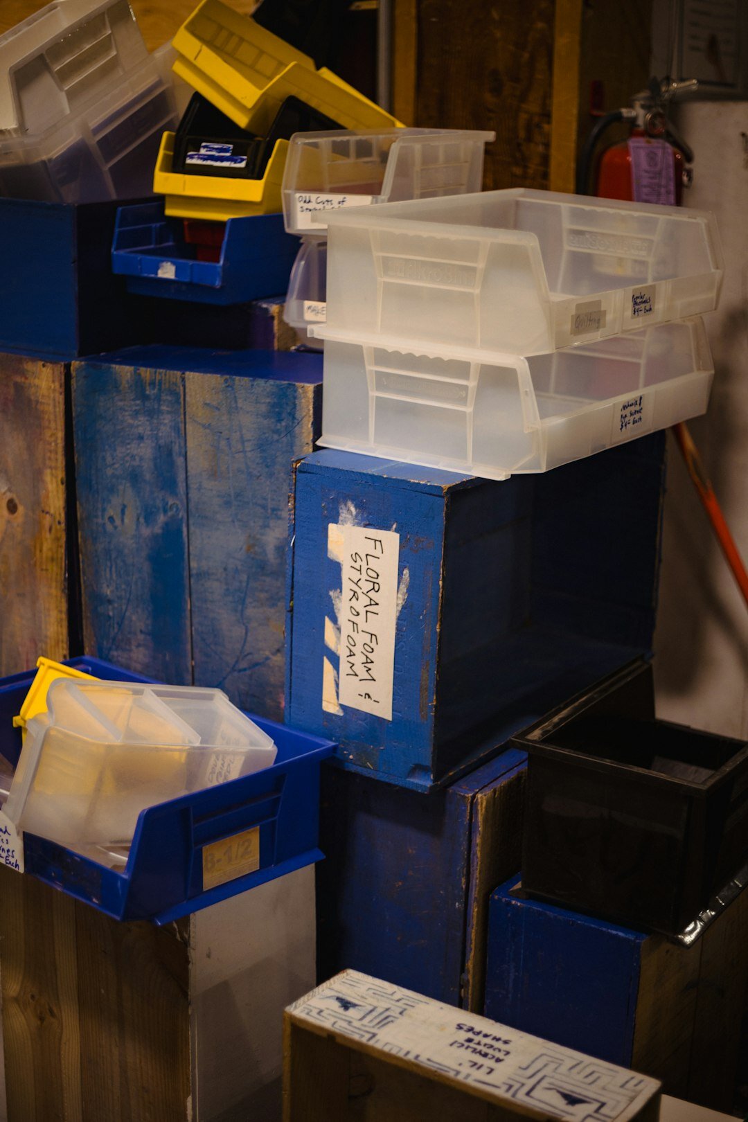 Rows of old archive boxes and film reels in a storage room